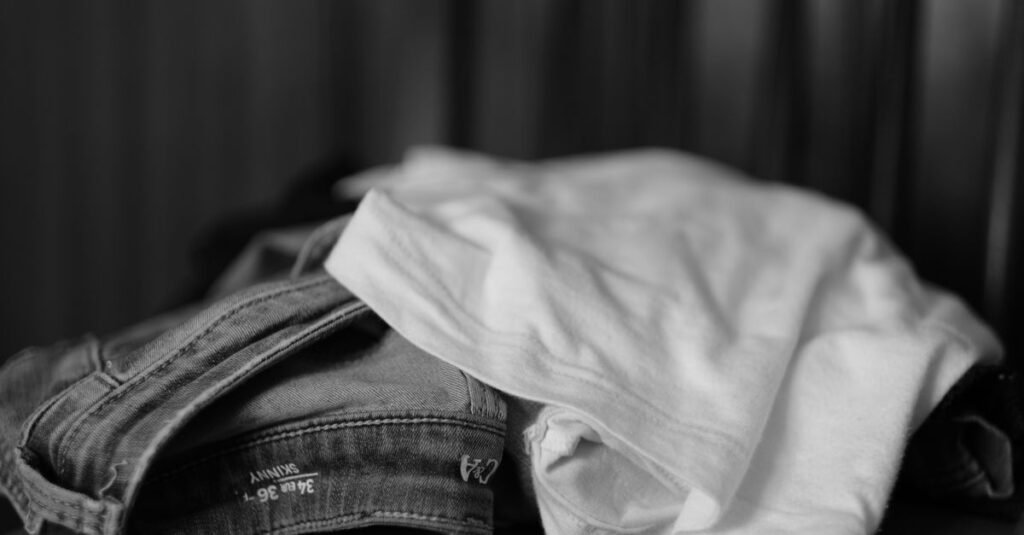 Monochrome folded white t-shirt and denim jeans