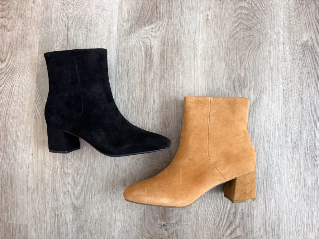 Ankle boots flat lay on neutral background