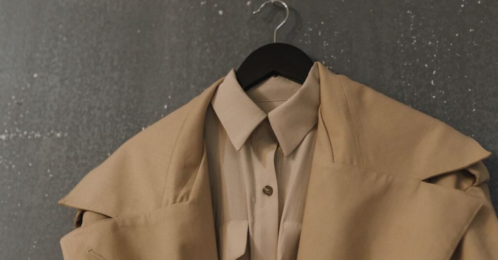 neutral beige coat and shirt on a hanger, fall wardrobe basics