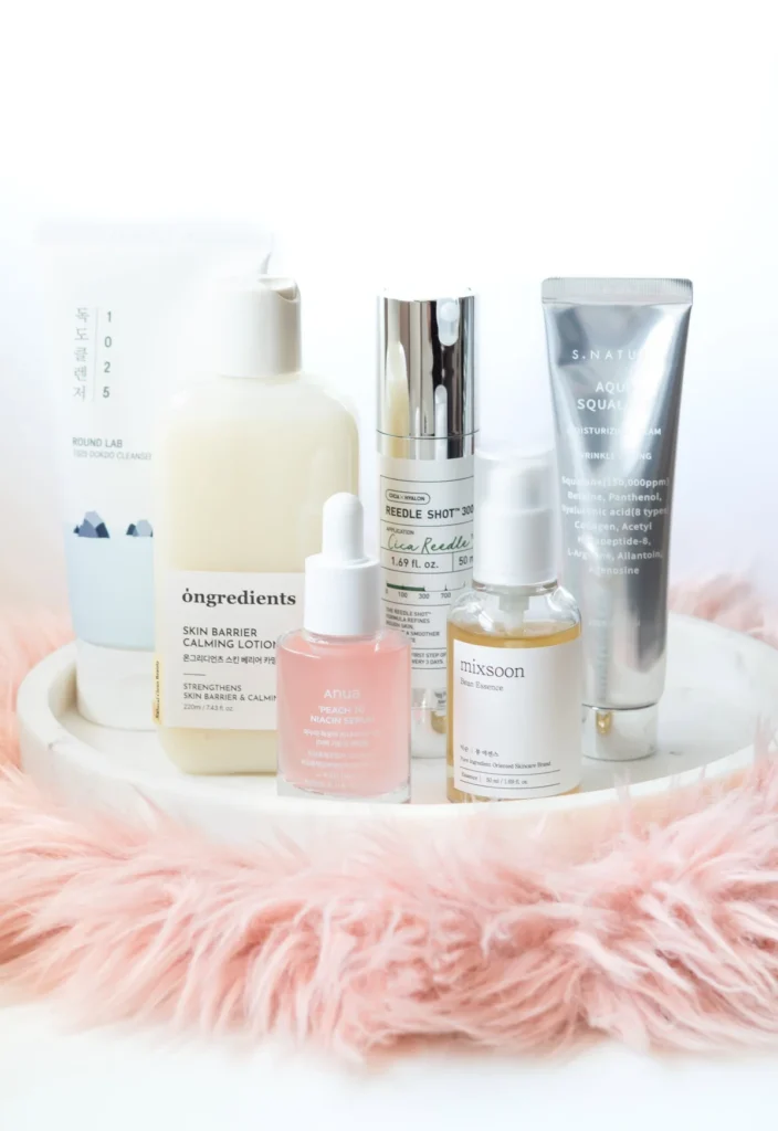 Flat lay of six K-beauty skincare products on a clean surface