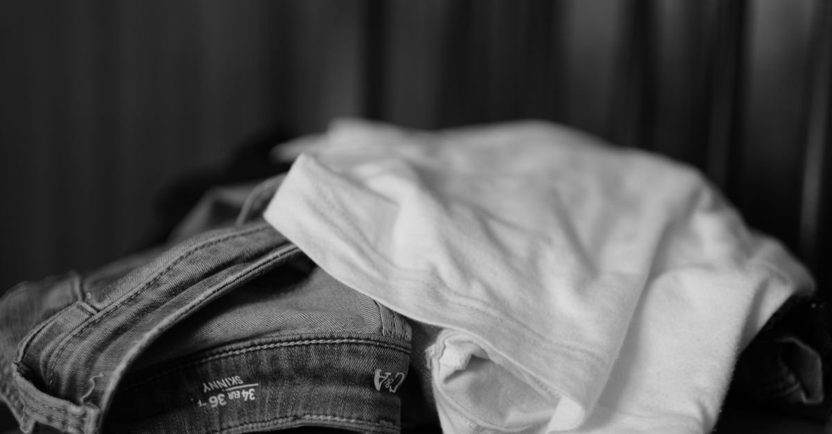 Monochrome folded white t-shirt and denim jeans
