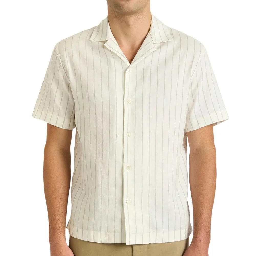 Statement print short sleeve shirt laid out on neutral backdrop