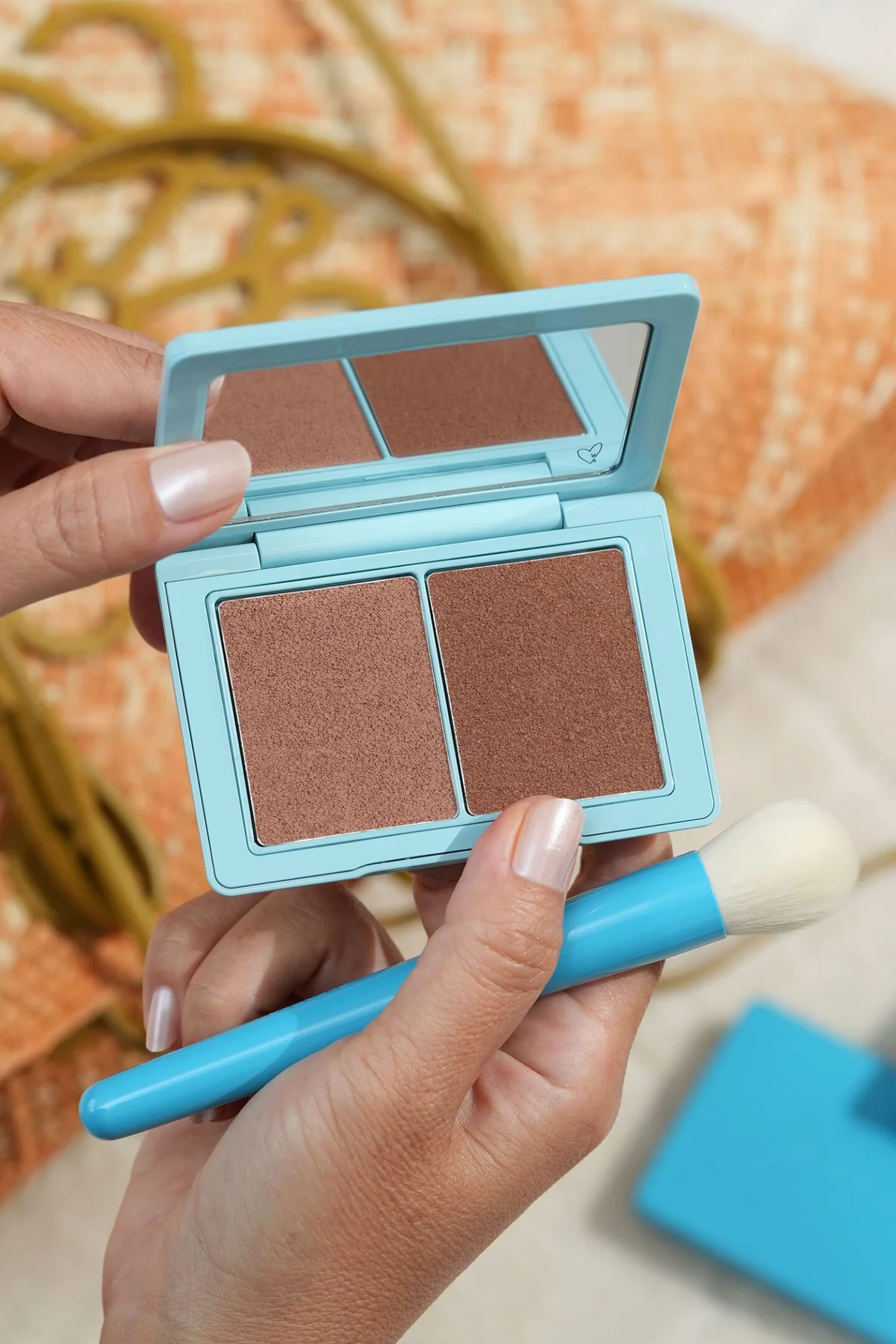 Close-up of bronzer applied to cheek with satin finish
