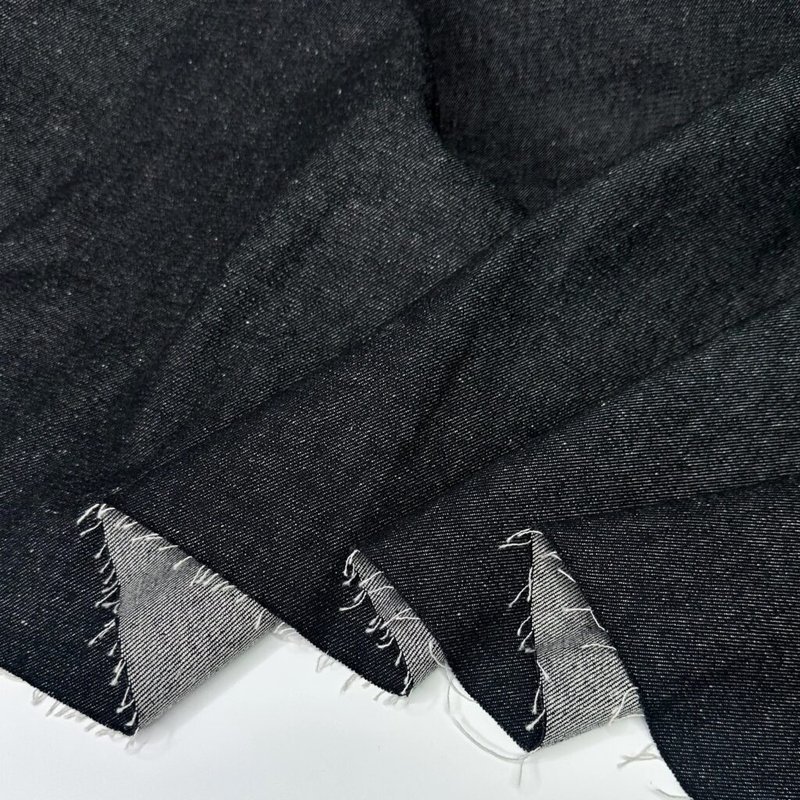 Black 12oz denim fabric swatch folded neatly