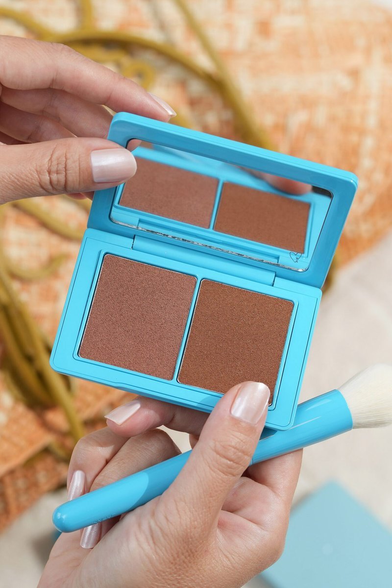 Arm swatch comparison of multiple cream bronzers