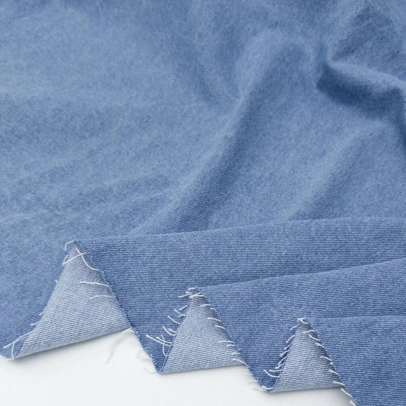 Blue denim chambray fabric sample folded flat