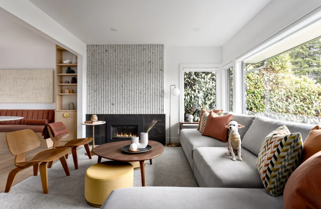 Large neutral rug anchoring an earth-toned living room