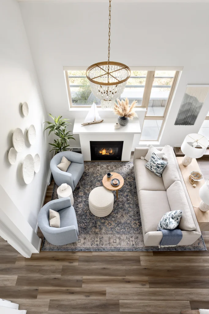 Patterned rug extending under sofa in open-concept living room