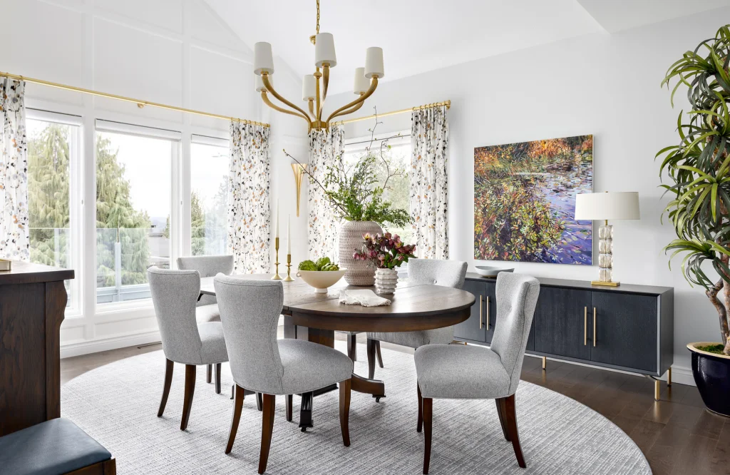 Oval gray area rug in a traditional dining room