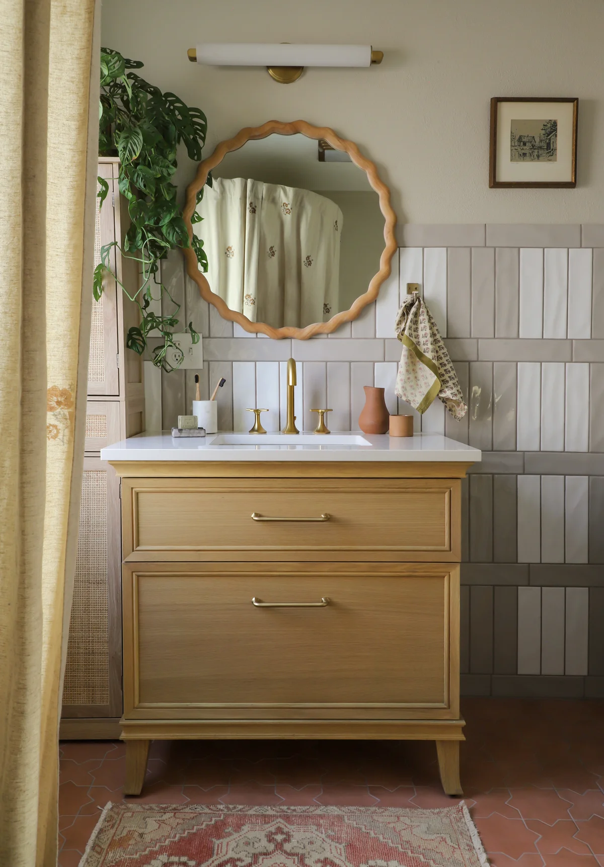 Vintage green toilet with plaid tile wall and mini gallery above