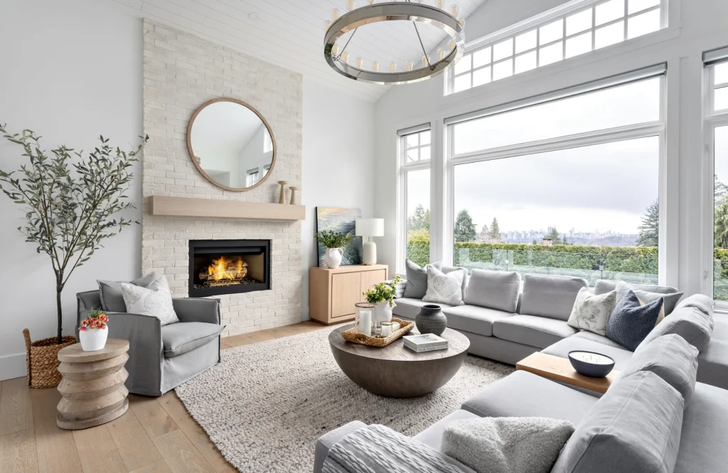 Wool area rug beside a stone fireplace in neutral living room
