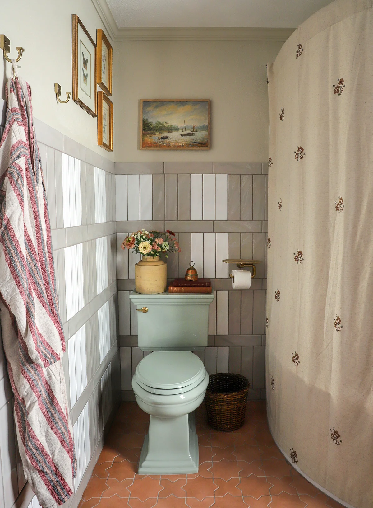 Mint vintage toilet with plaid tile wall and shower curtain