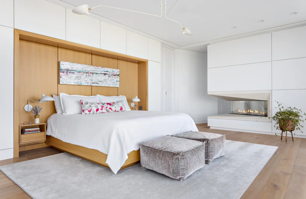 Gray area rug in a calm primary bedroom interior