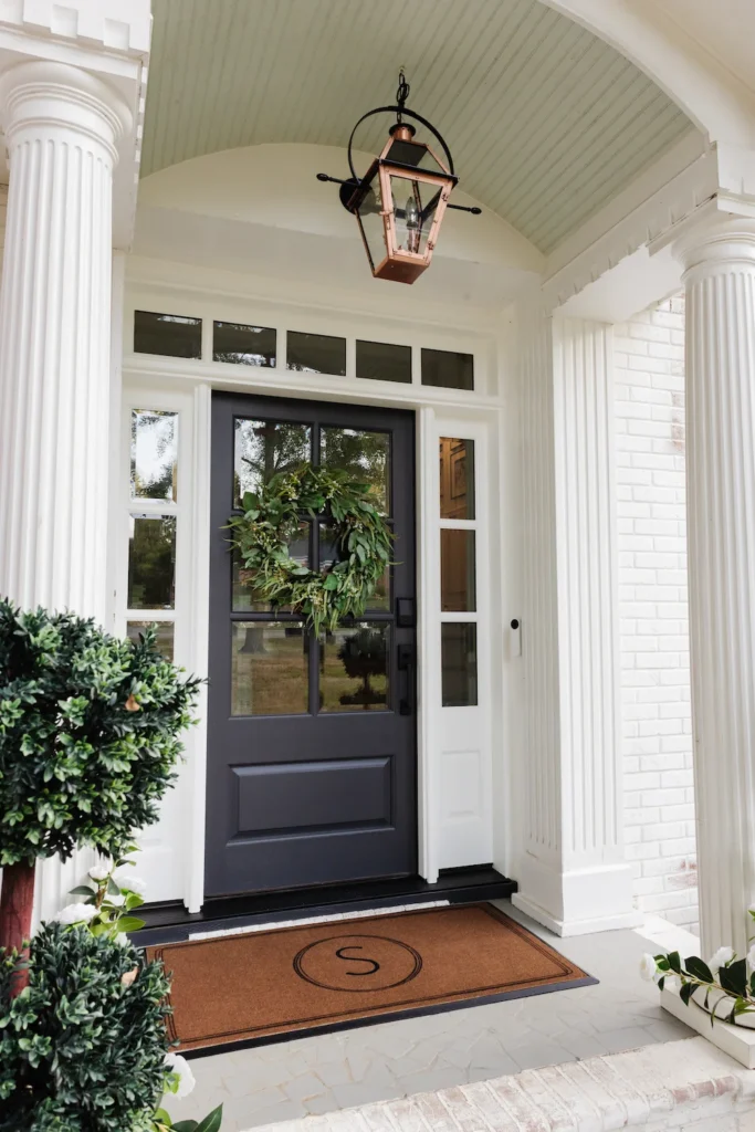 Smart doorbell on an older home's front porch at dusk