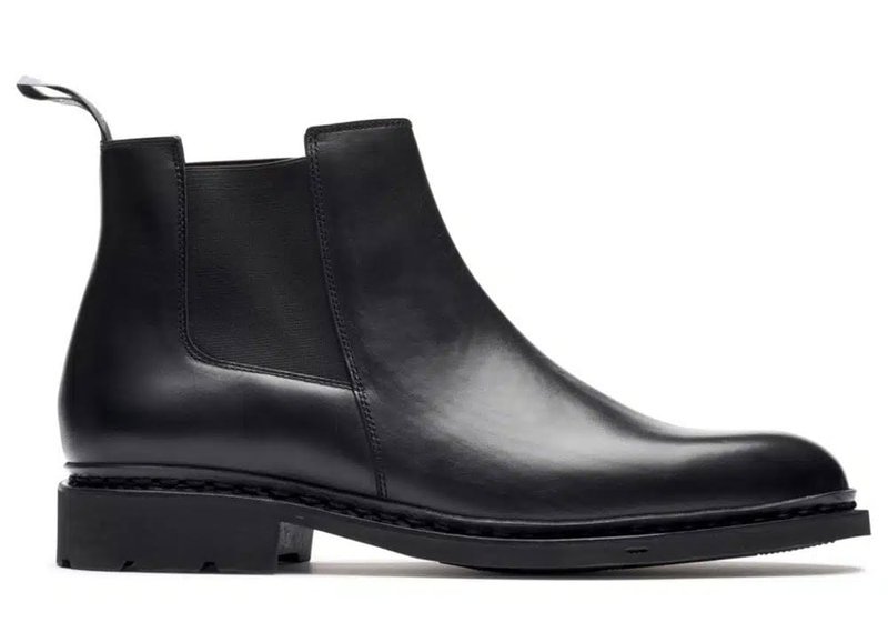 Black leather Chelsea-style boot with a smooth polished finish
