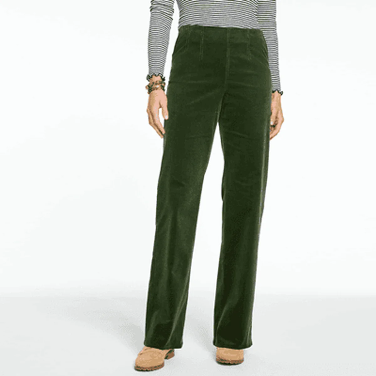 Forest green corduroy pants styled with a striped top and tan boots.