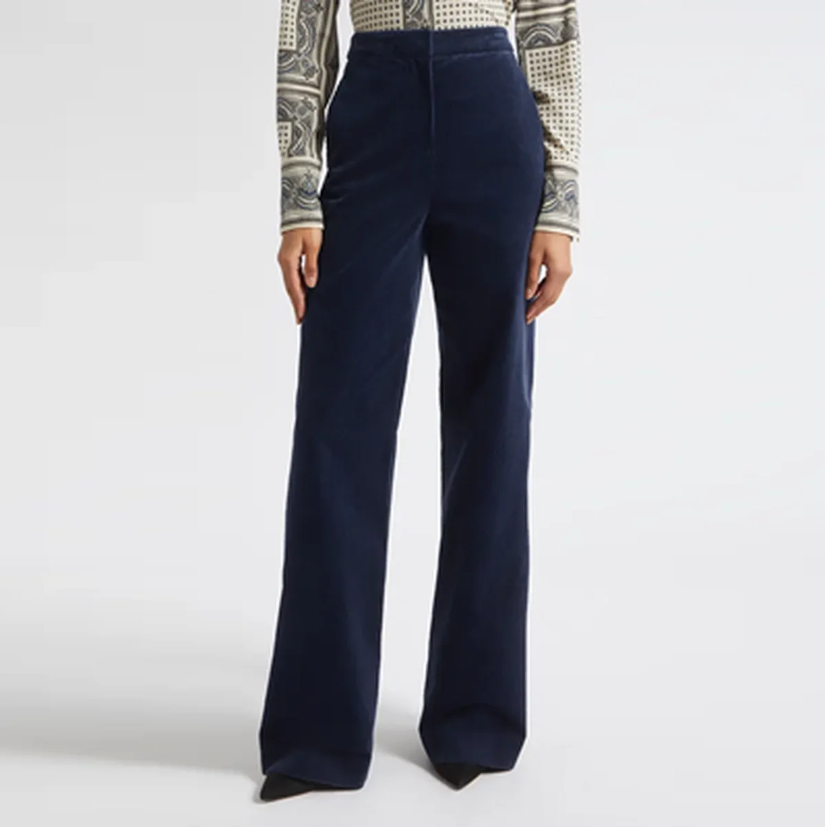Straight-leg corduroy trousers in a neutral tone for office styling.